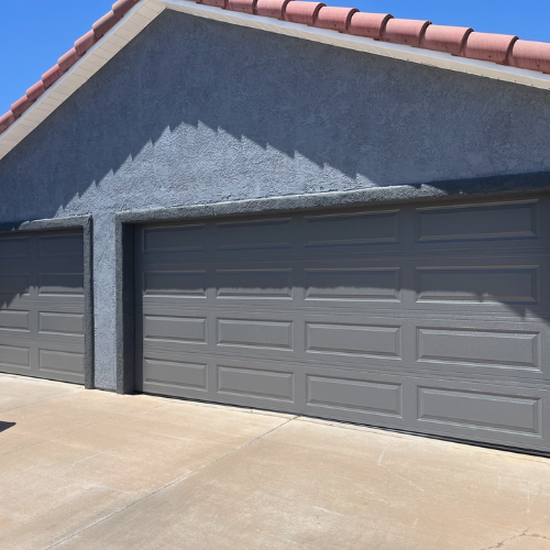 Three-car garage featuring sleek, custom garage doors with clean lines and a modern finish, installed by Garage Mirage in Southern Utah.
